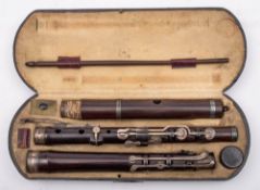 Monzani & Co - a George IV rosewood and silver mounted three-section flute: the mounts marked for