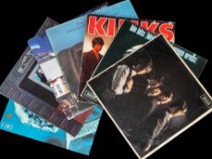 A group of eight vinyl albums including early issues of ROLLING STONES and The KINKS together with