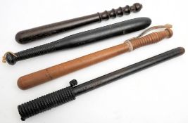 A group of four various Police truncheons: comprising a Devon Constabulary truncheon stamped with