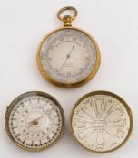 A gilt pocket aneroid barometer by Arnold & Co,