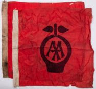 Two vintage AA flags: red with central black stencilled emblem,