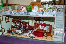 A 20th Century doll's shop 'Serendipity' with fitted interior, figures, fixtures and fittings.