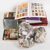 A collection of vintage and modern matchbox covers: some loose and some mounted in albums and