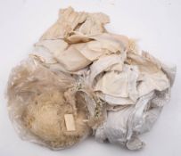 An late 18th century silk purse: assorted christening gowns and undergarments,