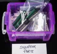 A collection of Sheaffer fountain pen spare parts: comprising barrels, caps and fillers.