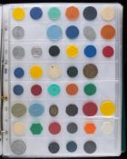 An album containing a large number of transport tokens including bus, tram and railway:.