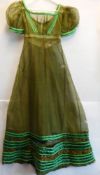 A Regency period green muslin dress: with high waisted panel front,