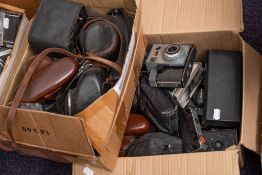 A collection of various cameras including: Olympus 35RC and others,