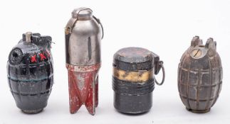 Two Mills bomb hand grenades together with two other grenades.