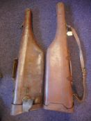 Two stitched leather leg-of-mutton gun cases:, one in need of repair. (2).