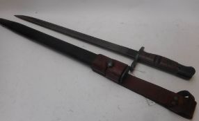 A Remington US 1917 bayonet: with 43cm fullered parkerized blade and blued fittings,