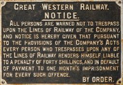 A GWR cast iron trespass notice: white text on black ground, 50cm x 72cm.