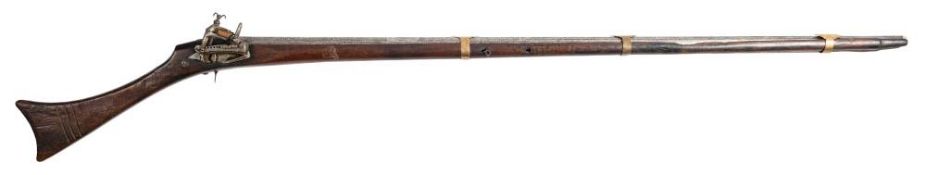 An Arab style flintlock musket: plain 42 1/2 inch barrel with triple decorative brass bands,