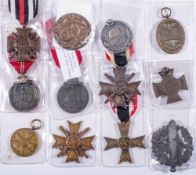 A group of WWI and WWII German medals including: Cross of Honour 1914-1918, War Merit cross,