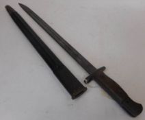 A 1907 bayonet for Lanchester, S M G: with 43cm fullered blade, wood slab grips, marked W S C S294,