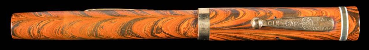 A 1920s Waterman hard rubber ripple fountain pen: with 9ct gold band to cap and No.