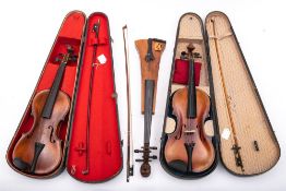 An early 20th century German Savart style violin: the headstock with carved moustached man above