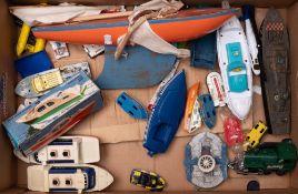 A boxed Scalex clockwork Cruiser together with a collection of various toy boats: