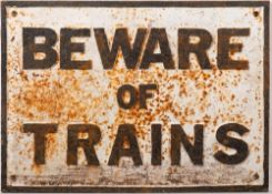 A cast iron railway sign 'Beware of Trains': black text on white ground, 35 x 49cm.