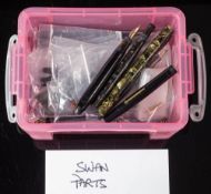 A collection of Swan fountain pen spare parts: comprising barrels caps and nibs etc.