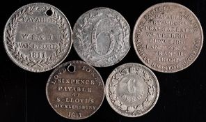 An 1811 silver shilling token, Bristol,: an 1811 silver shilling token, Andover (holed), Fazeley,