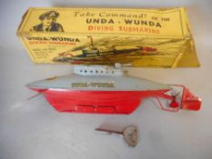 Sutcliffe, a tinplate clockwork 'Unda-Wunda Diving Submarine': with two tone grey and red hull,