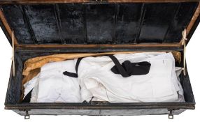 A tin trunk inscribed 'R L Garnons-Williams.