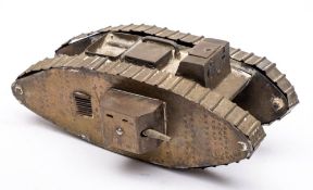 A WWI Trench art model of a tank: with box turret and exhausts to top, (missing one side gun) 23.