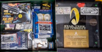 A collection of various Star Trek toys and collectibles including: a playmates classic Star Trek