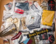 A collection of various cloth patches and shoulder badges: including a WWII Civil Defence Corps