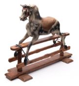 An early 20th century rocking horse by G and J Lines Brothers,