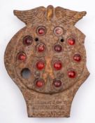 A vintage cast iron AA road sign: in the form of an AA badge with amber glass inserts,