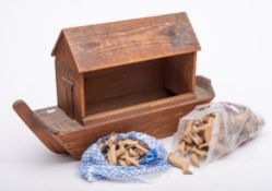 A late 19th century pine Noah's Ark and animals: the ark with parquetry windows and a quantity of