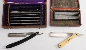 An early 20th century cased set of razors: each blade marked with a different day of the week,