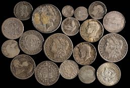 A group of silver coins including an 1885 USA dollar: an 1890 USA dollar, 1923 dollar,