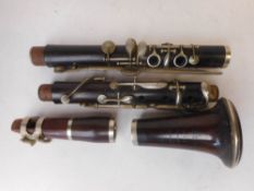 A five-section rosewood clarinet: by Joseh Highams, Strangeways Manchester.