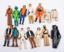 A group of vintage Star Wars figures.