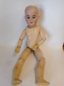 An Armand Marseille bisque head doll: impressed 1894. A.M. 6 DEP.
