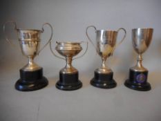 Four assorted silver trophy cups, various makers and dates: all awarded to H.M.Hicks, includes; W.C.