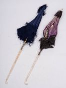 Two late Victorian/Edwardian ivory handled parasols: one carved with oak leaves and acorns,