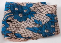 A 1970's Celia Birtwell print scarf: of blue flowers on black lattice and pink ground,