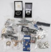 A collection of reproduction German Military badges: including NSDAP badges and others.