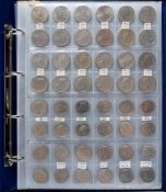 An album containing modern currency including £5, £2, £1 and 50p coins.