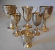 Six assorted silver trophy cups, various makers and dates: all awarded to H.M.