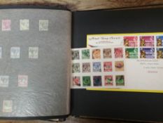 A collection Of Malaya and India stamps in an album: