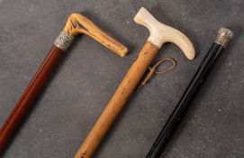 A late 19th/early 20th century ivory handled walking stick on Malacca shaft: 96cm long,