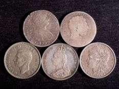 An 1887 crown, 1898 dollar, 1792 eight reales.