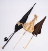 A group of three late Victorian/Edwardian parasols: one with ivory handle and shaft with foliate
