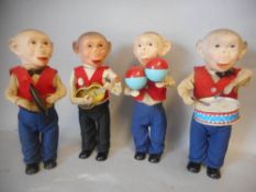 Max Carl, a post war four-piece clockwork monkey band: with moulded rubber faces,
