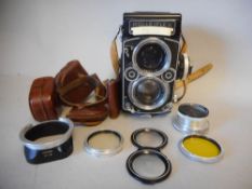 A Rolliflex 2.8F twin lens camera serial No 2415302: with diffuser, the upper lens Heidosmat 1:2.